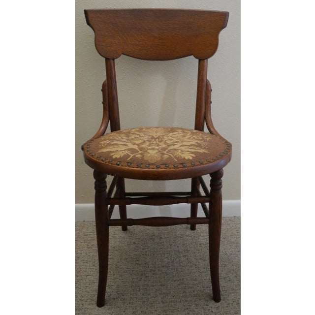 Up for sale is an Early 20th Century American Arts and Crafts Oak Bentwood Floral Motif Upholstered/Nailhead Seat Side...