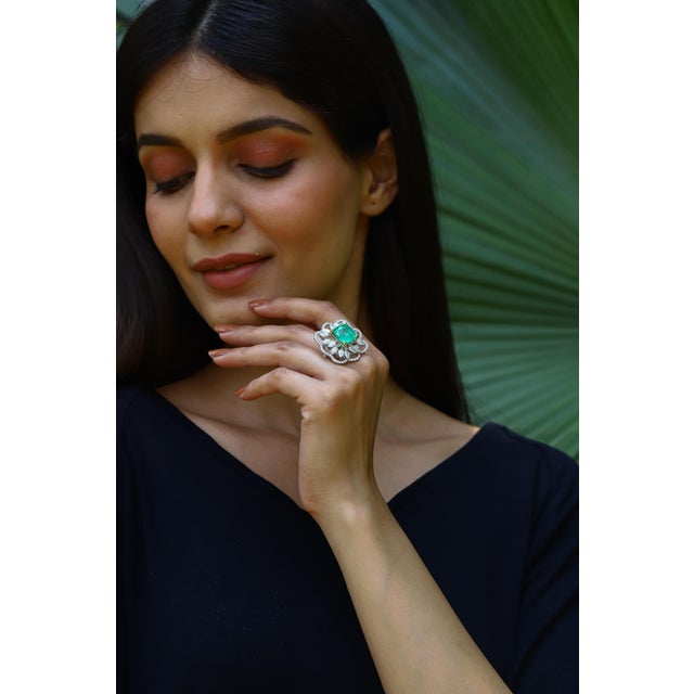 Diamonds : 4.37 carats Emerald : 7.47 carats Gold : 10.88 gm( 18k) This is a beautiful natural zambian ring with very high...