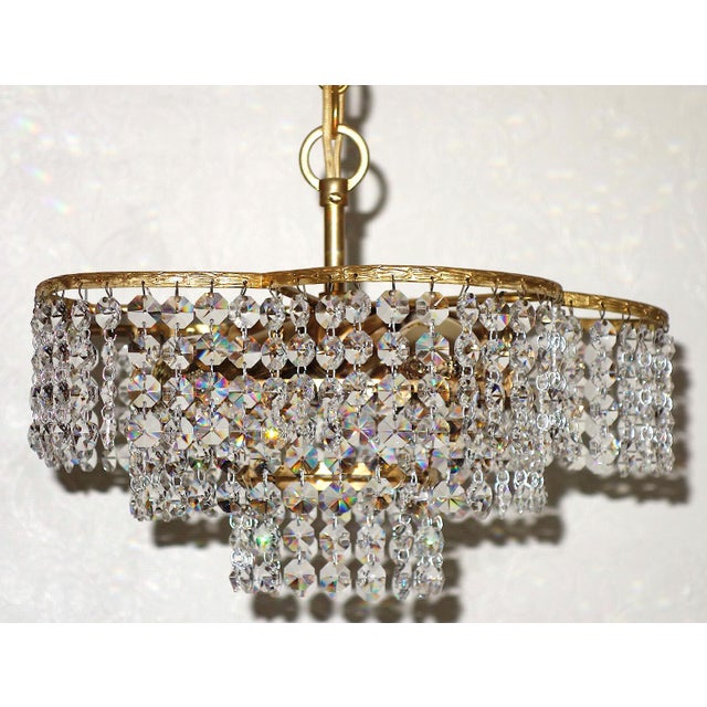 Brass and Lead Crystal 3-Light Chandelier from Palwa, 1960s, in Very Good conditions. Designed 1960 to 1969 This piece has...