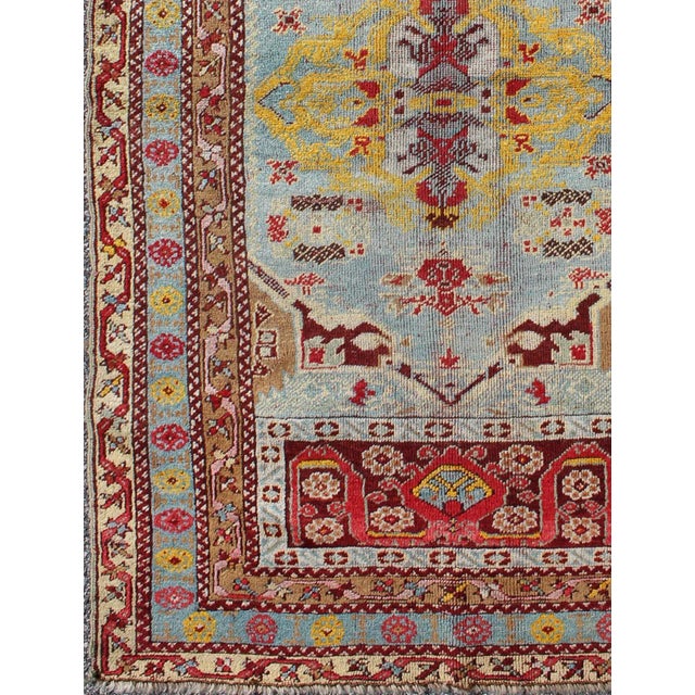 Turkish Antique Turkish Oushak Rug in Light Blue Background and Border For Sale - Image 3 of 7