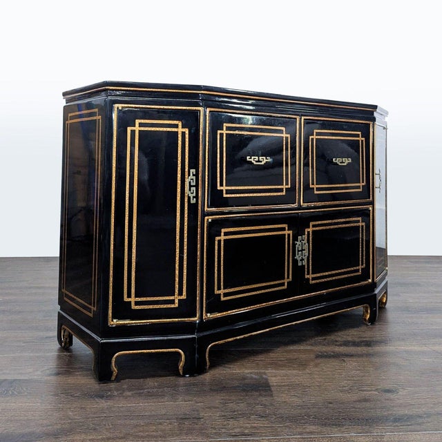 Striking black lacquer Chinoiserie credenza featuring hand-applied gold detailing, geometric paneling, and Asian-inspired...