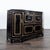 Striking black lacquer Chinoiserie credenza featuring hand-applied gold detailing, geometric paneling, and Asian-inspired...