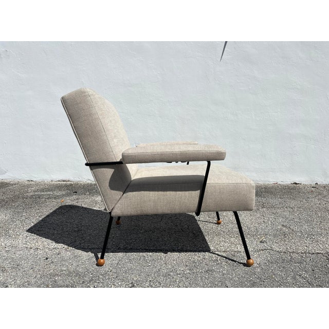 One 1950s Lounge Chair attributed to Milo Baughman, black Iron frame and legs with wooden ball feet, newly reupholstered...