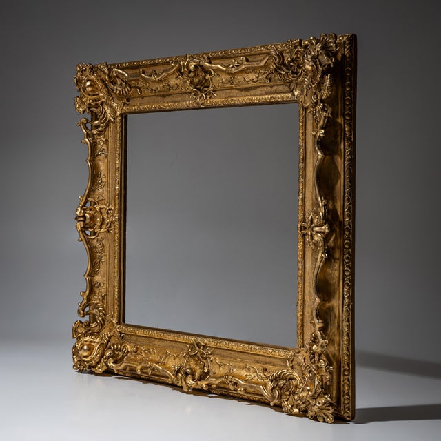 Rectangular gilt Louis XV stucco frame decorated with shell motifs and foliate scrolls, finely and deeply modeled. Sight...