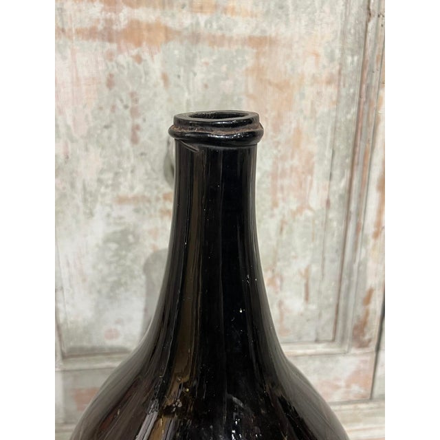 More information coming soon… Originally used to ferment wine at a vineyard in Normandy, France, this brown glass wine...