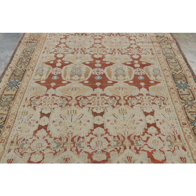Hand-knotted in premium wool circa 1920-1930, this 7x12 antique Persian Sultanabad rug is a luminous survivor of one of...