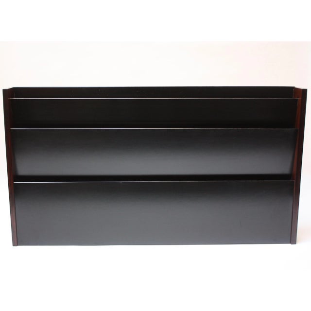 Wall-mounted magazine holder by Peter Pepper Products of Gardens, CA (circa 1970s). Composed of a black laminate divider...