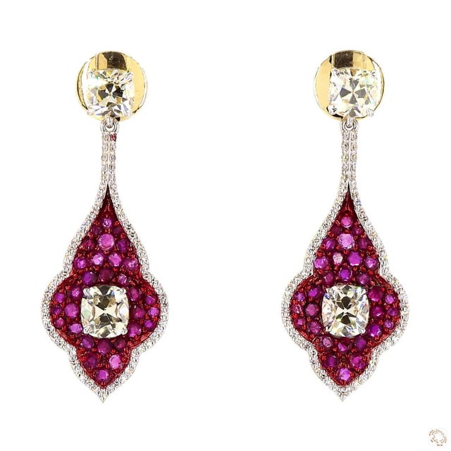 These estate earrings from our contemporary estate collection center on a 2.87-carat diamond in a soft cushion cut. They...
