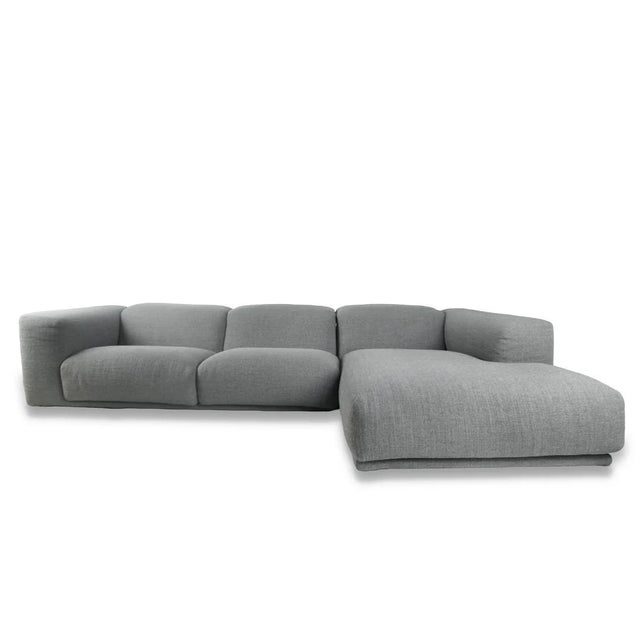 The Design Within Reach Kelston Sectional by Matthew Hilton, Attributed. embodies relaxed modernity with sculptural lines...