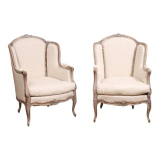 French Louis XV Style 1880s Painted Bergère Chairs with Carved Floral Motifs - A Pair For Sale