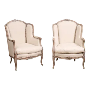 French Louis XV Style 1880s Painted Bergère Chairs with Carved Floral Motifs - A Pair