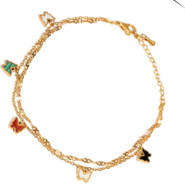 Bring playful elegance to your style with the Rainbow Butterfly Charm Gold Anklet. Featuring a double gold-toned chain...