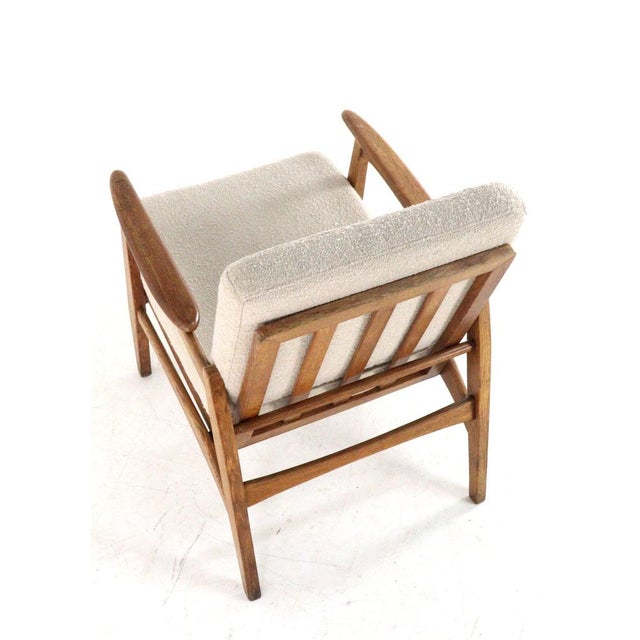 Dutch Modernism with a dynamic twist. This armchair is a beautiful example of the Dutch interpretation of the Mid-Century...