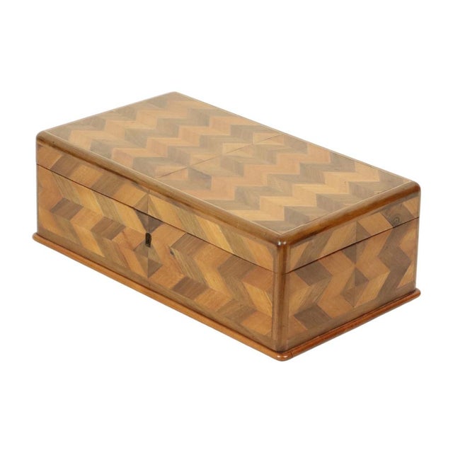 Old wooden box, jewelry, or trinket box made of inlaid pieces of wood, marquetry box with geometric chevron design, circa...