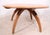 Iconic Heywood Wakefield Lazy Susan coffee table with arched wishbone legs. The table features a circular disk form top...