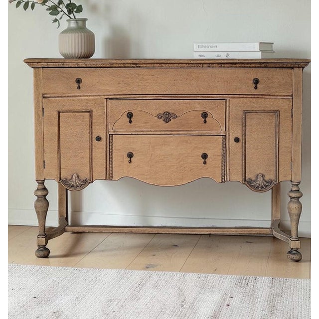 Dimensions: 54"L x 39"H x 19"D Tiger Oak quarter sawn solid wood sideboard / buffet with scalloped apron turned legs,...