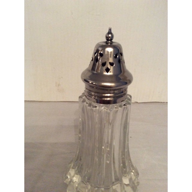 Lovely cut glass antique sugar shaker.