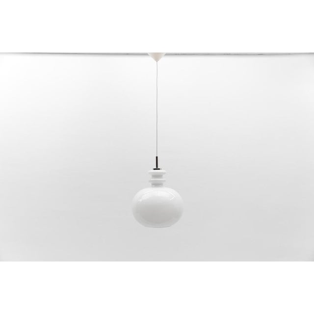 Lovely white glass ceiling lamp by peill & putzler, 1960s the cable length with lamp is 105cm in total, can be adjusted...