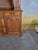 An elegant two-part louis xv style buffet crafted from walnut, featuring richly carved rococo-inspired decoration. the...