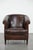 We are offering this stylish and characterful dark brown vintage club chair in English style, made of sheepskin leather...