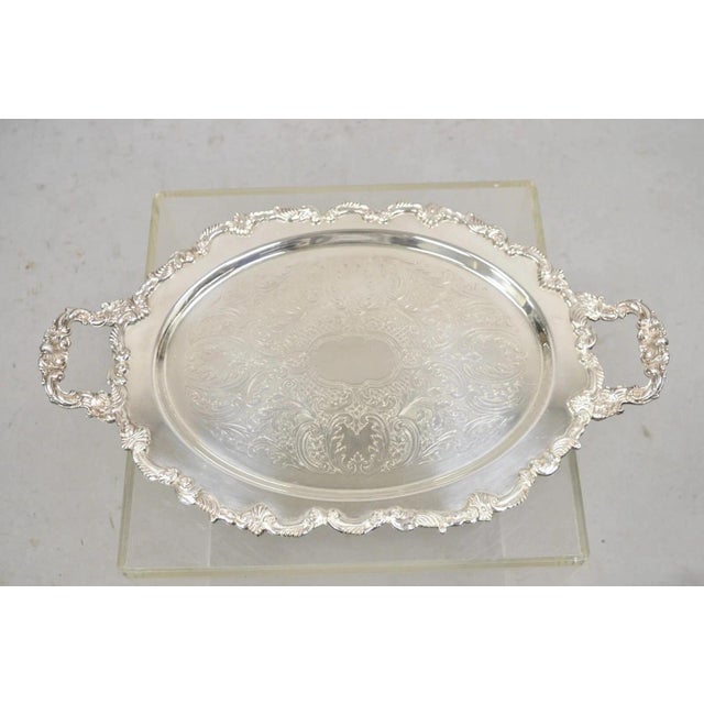 Vintage English Victorian Style Silver Plated Oval Platter Tray Crown Hallmark. Item featured is raised on ornate feet,...