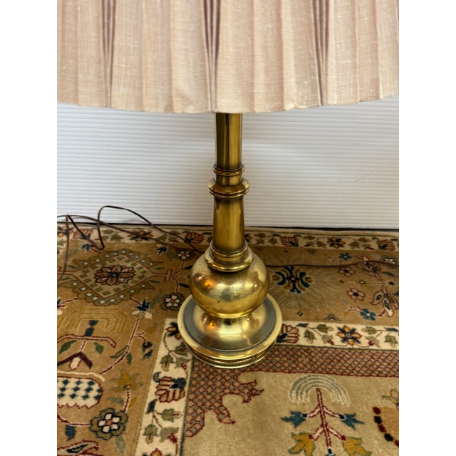 Design Plus Gallery presents a Pair of Stiffel Table Lamps. The lamps are from the mid to late 20th century and have cast...