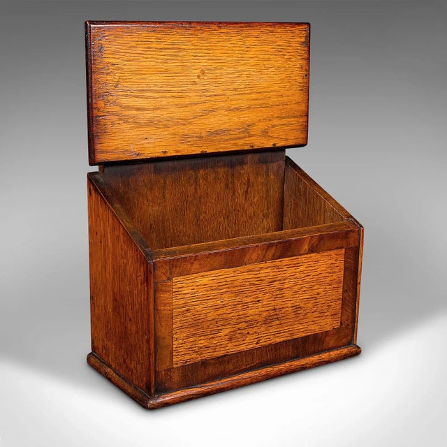 This is an antique glove box. An English, oak lidded keepsake or reception key case, dating to the Georgian period, circa...