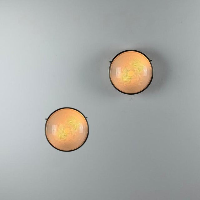 An iconic pair of “Sigma” ceiling or wall lights designed by Sergio Mazza for Artemide in the 1960s, refined expressions...