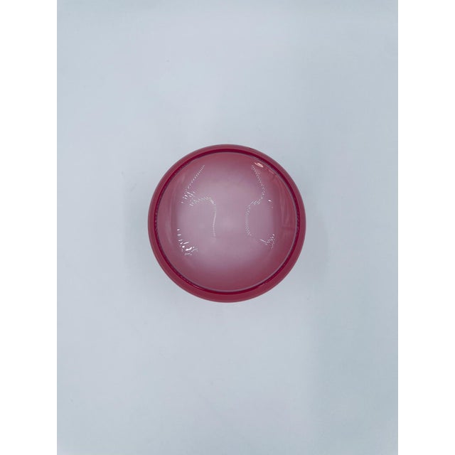 A vintage-style goblet, crafted from high-quality art glass. The goblet is distinguished by its wide, flattened bowl in a...