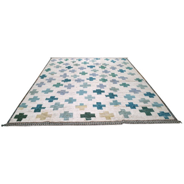 Hand-knotted with care using traditional rug making techniques, this wool rug blends timeless craftsmanship with a modern...