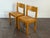 1970s set of four Maison Regain solid elm and rush dining chairs in good vintage condition. Signature sticker of french...
