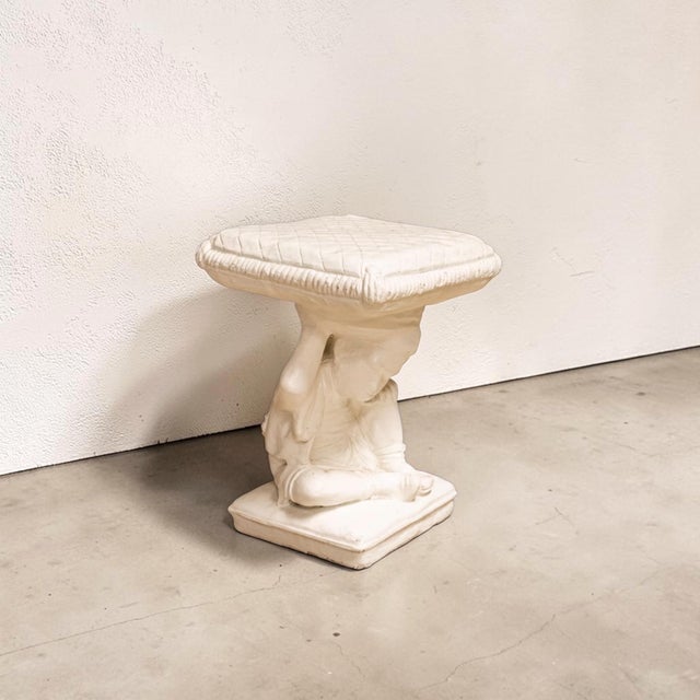 American cast cement garden stool or table featuring a classical child figure seated beside a lion and supporting a...