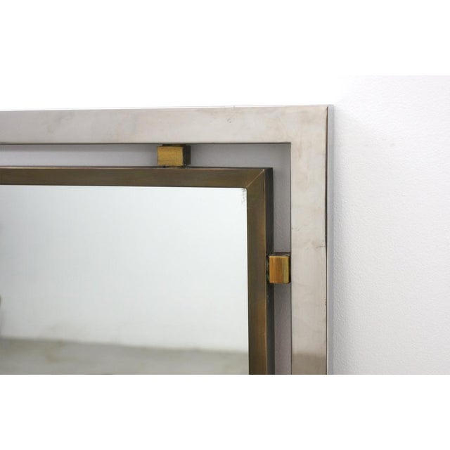 Mirror of Italian production from the 70s. External frame in stainless steel, internal frame and spacers in brass. The...