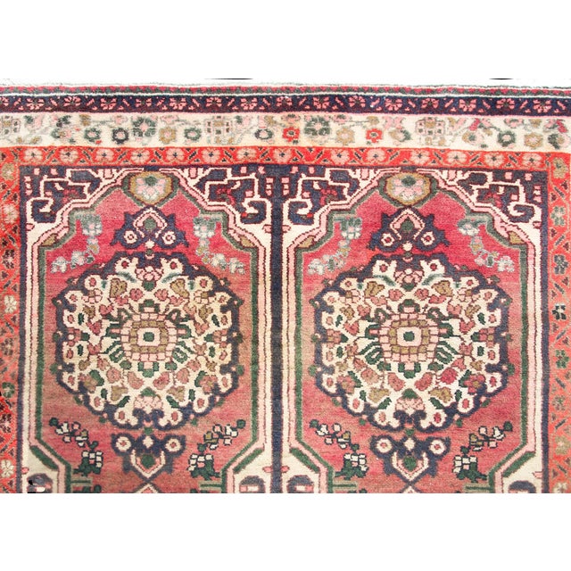 A wonderful mid-20th century Persian Hamadan rug with six large floral medallions living amidst a field of more flowers,...