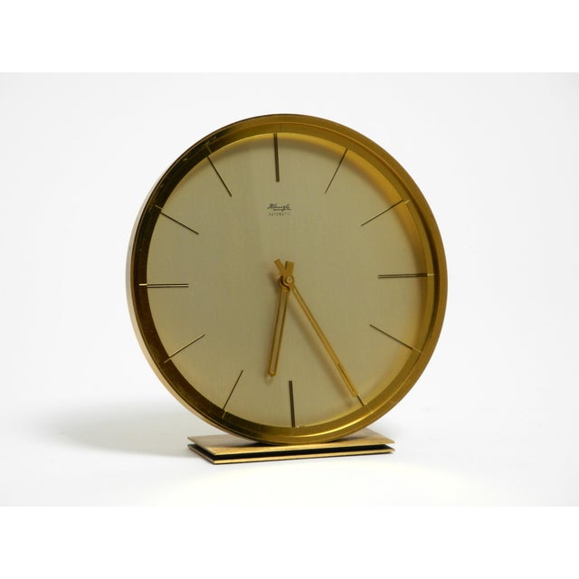 Beautiful, elegant, original 1960s solid brass table clock by Kienzle. Still with the original box. A fantastic, very...