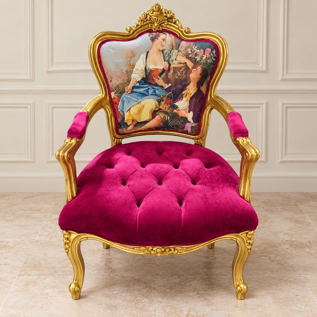 Make a statement with this ornate French-style armchair, featuring rich burgundy velvet upholstery and an elaborately...