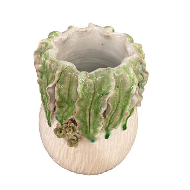 Bring a touch of whimsical Italian artistry into your home with this stunning vintage ceramic vase, masterfully...