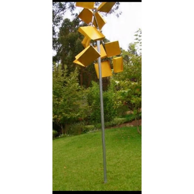 “Well Connected / Yellow” is a 2008 outdoor kinetic wind sculpture crafted from stainless steel and aluminum. This vibrant...