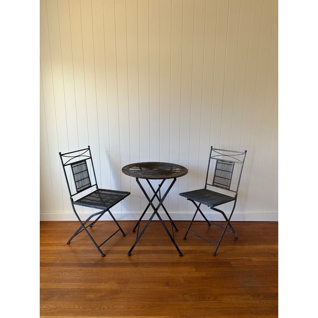 This vintage three-piece bistro set carries the easy charm of mid century modern outdoor living. With a compact footprint...