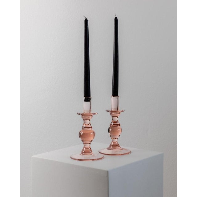 This set of 2 vintage glass candle holders, designed in a simple, timeless ball shape with a light peach tone is a perfect...