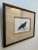 This is an original black crow watercolor painting with an elevated woven mat in a black and gold frame signed R.D.