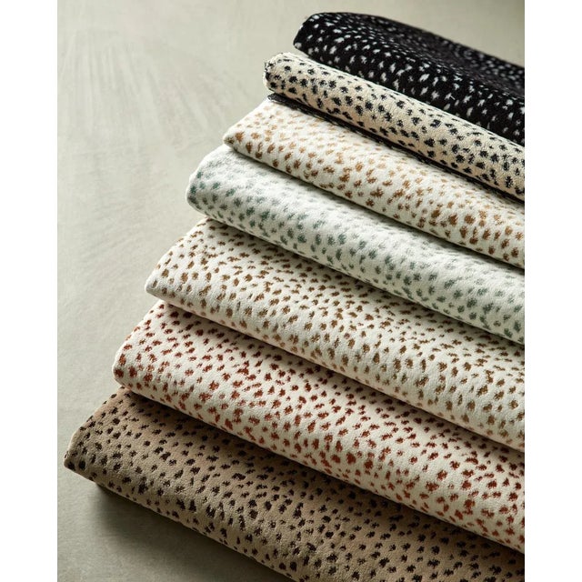 This new animal spot is set to be an instant Harlequin classic. This softly freckled fabric appears to be a dainty design...