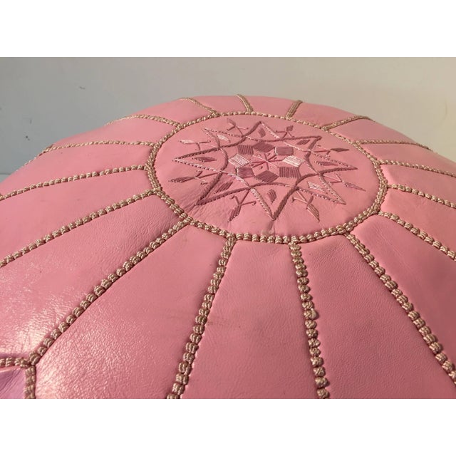 Moroccan baby pink color round pouf hand tooled and embroidered in Marrakesh. Beautiful geometrical designs are hand-...