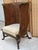 Exquisite late 20th-century British Colonial-style wingback chair by renowned luxury maker Maitland-Smith. This striking...
