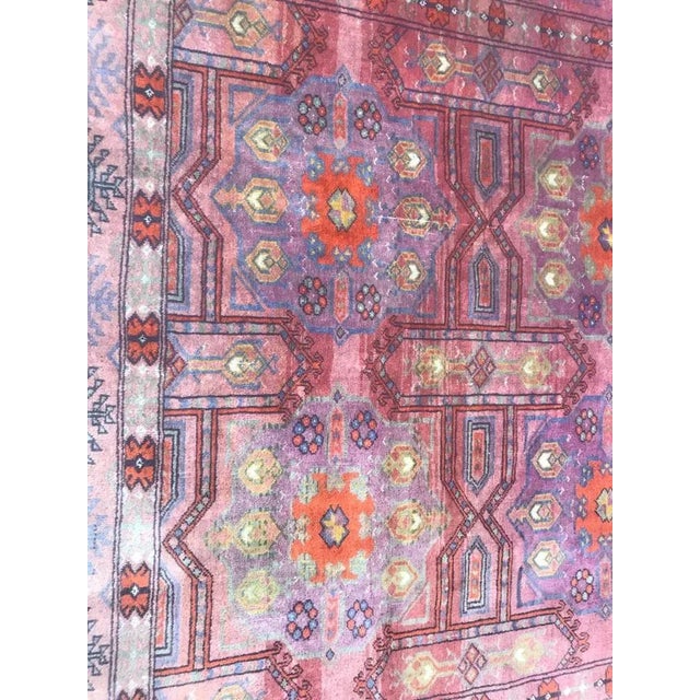 Beautiful Turkmen rug with nice geometric design and purple and pink field colors with blue and green. Entirely and finely...