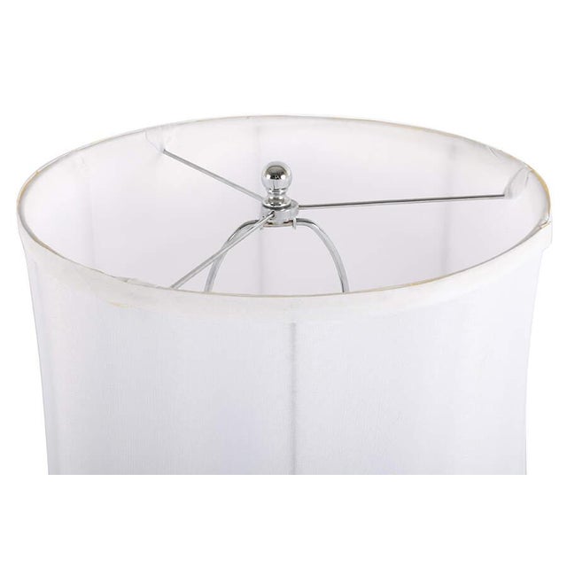 This Mid‑Century Modern stacked acrylic spheres table lamp features a clean, sculptural silhouette defined by a vertical...