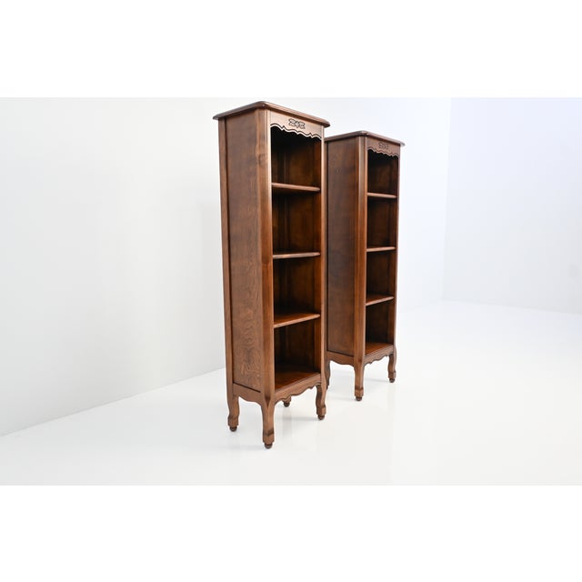 A well-proportioned pair of cherry bookcases by Stickley Brothers, Grand Rapids, from their “Quaint Furniture” line, circa...