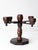 A vintage five-arm wood candelabra with a sculptural Spanish Revival silhouette. Five turned candle cups rise from crossed...