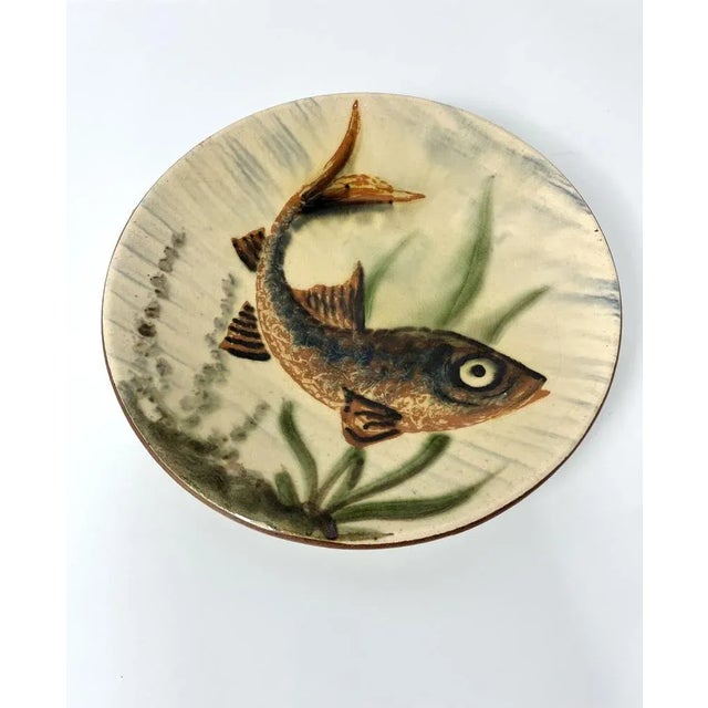 Decorative ceramic plate with fish decor by Puigdemont, Spain, 60’s Can be hung on the wall Signed below This piece has an...