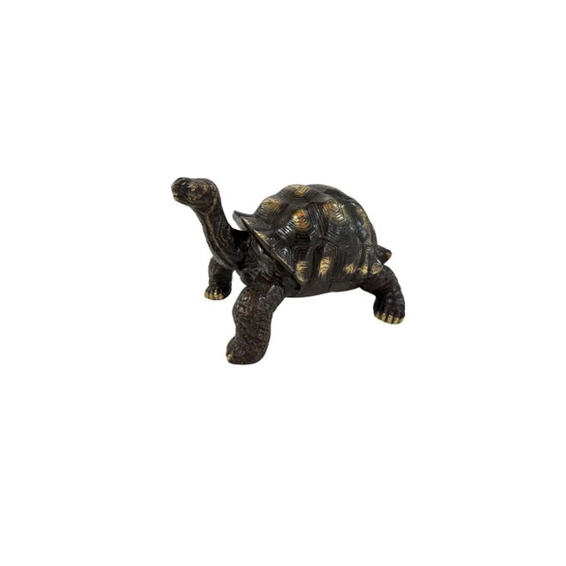 This solid brass tortoise is a finely crafted decorative object that celebrates patience, longevity, and enduring...
